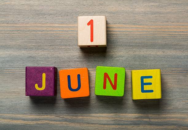 istock Day. 1 june text on wooden background 472481334