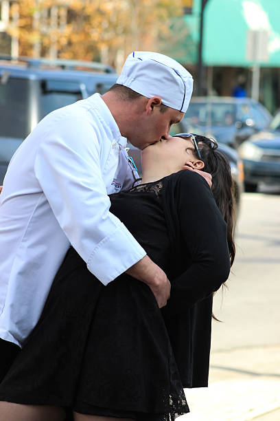 Culinary Student and Girlfriend Kiss on City Sidewalk