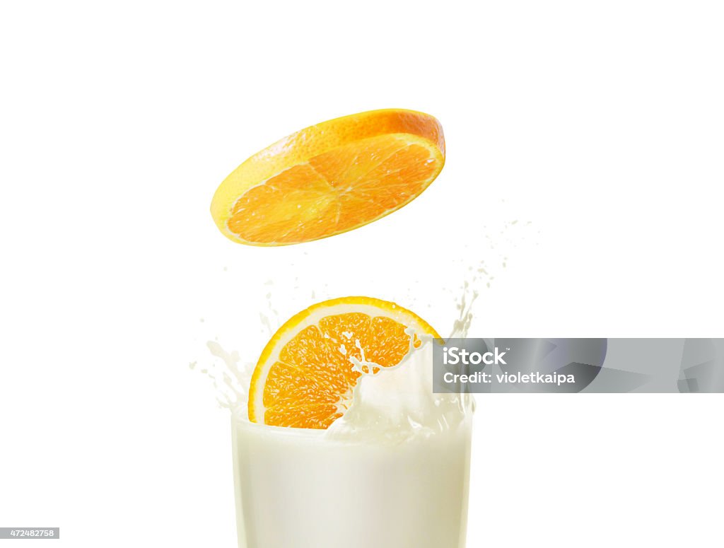Milk and orange Milk shake in a glass beaker with orange 2015 Stock Photo