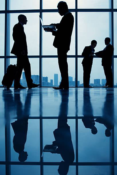 istock Business people in airport 472482992