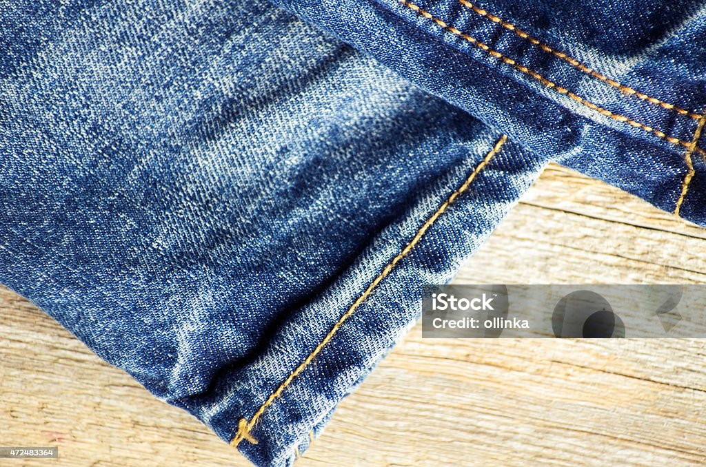 Blue jeans on old wooden surface 2015 Stock Photo