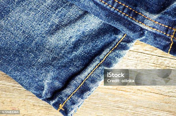 Blue Jeans On Old Wooden Surface Stock Photo - Download Image Now - 2015, Backgrounds, Blue