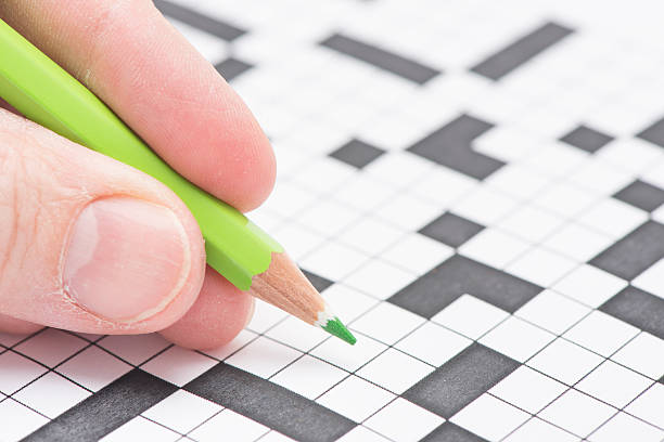 istock Crossword puzzle and pen 472484402