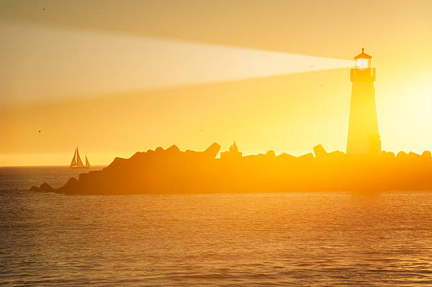 istock Light house with sunset in the background 472484990