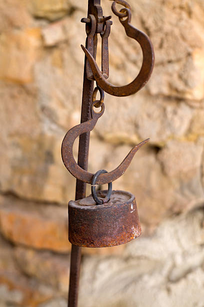 istock Antique scales rusted iron with weights 472485762