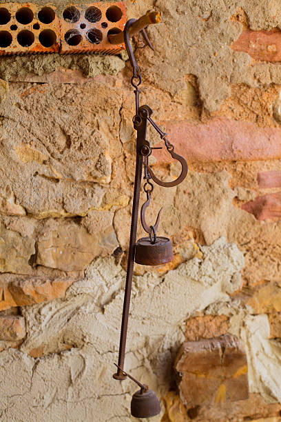 istock Antique scales rusted iron with weights 472485764