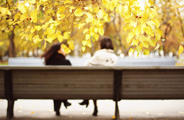 istock Abstract people in autumn park 472486852