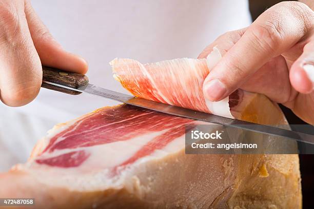 Professional Cutting Of Serrano Ham Stock Photo - Download Image Now - 2015, Animal Body Part, Animal Leg