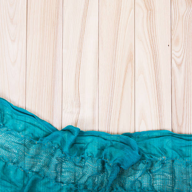 istock green scarf on wooden background 472487972