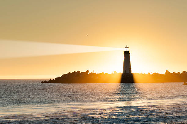 istock Light house with sunset in the background 472488052