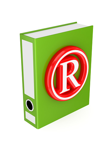 Green folder with red copyright symbol.3d rendered. Isolated on white background.