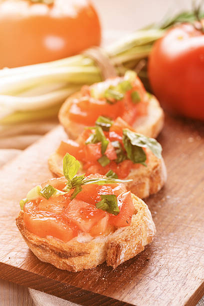 istock simple italian appetizing bruschetta with tomato and basil, on o 472490150