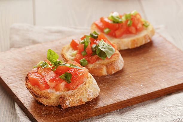 istock simple italian appetizing bruschetta with tomato and basil, on o 472490162