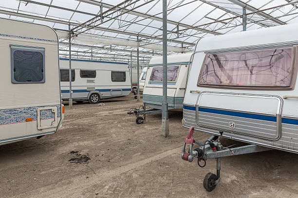 White caravans parked in an empty Dutch greenhouse Caravan parking in an empty Dutch Greenhouse storage compartment photos stock pictures, royalty-free photos & images