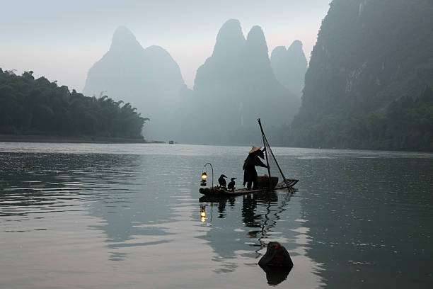 istock Fishing with cormorants birds in Yangshuo 472491994