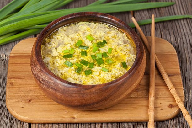 istock Bowl of  traditional chinese yellow drop egg soup with broth 472492014