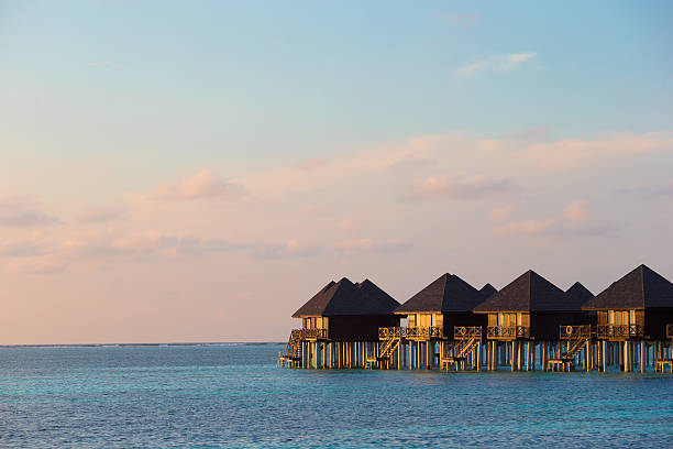 istock Water villas, bungalows on ideal perfect tropical island 472493400