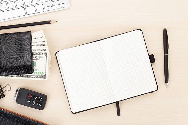 istock Office table with pc, supplies and money cash 472494266