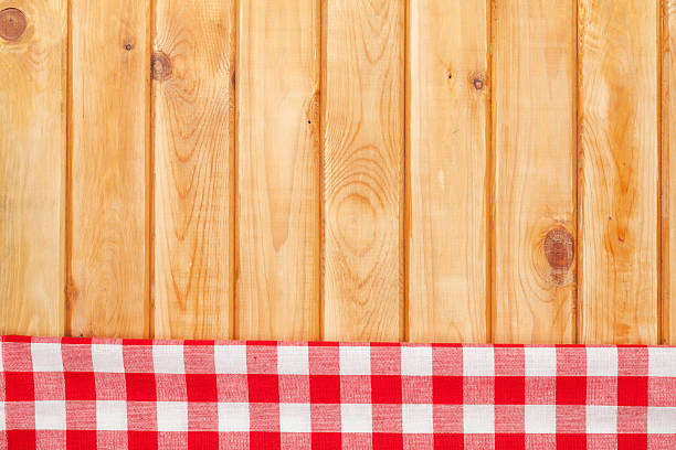 istock Red towel over wooden kitchen table 472494610