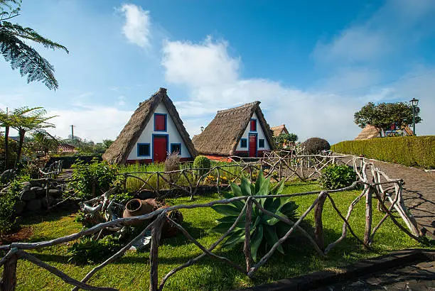 The typical houses of Santana is an ex -libris of the municipality of Santana and tourist attraction in Madeira . These houses have a triangular shape and are covered with thatch . Popularly known as Santana houses.