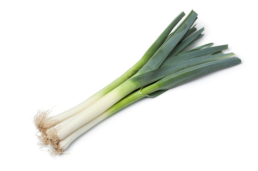 Fresh leek stems on white background