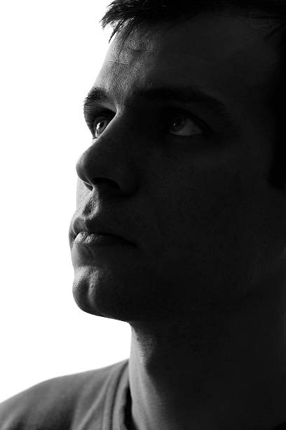 istock black-and-white portrait of a sad man 472497312