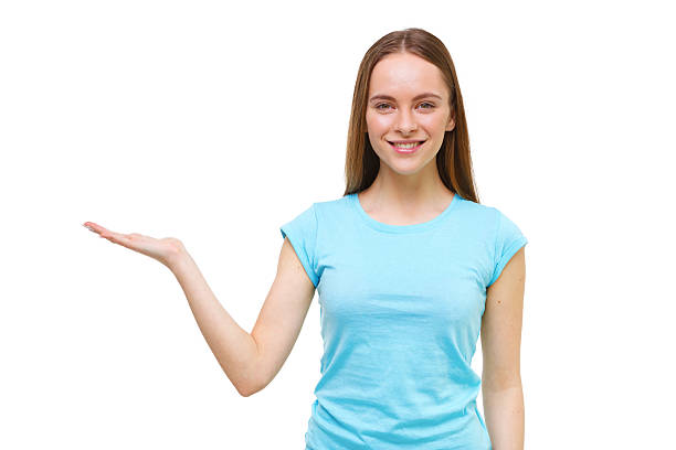istock Young woman presenting something with open hand isolated. 472498096