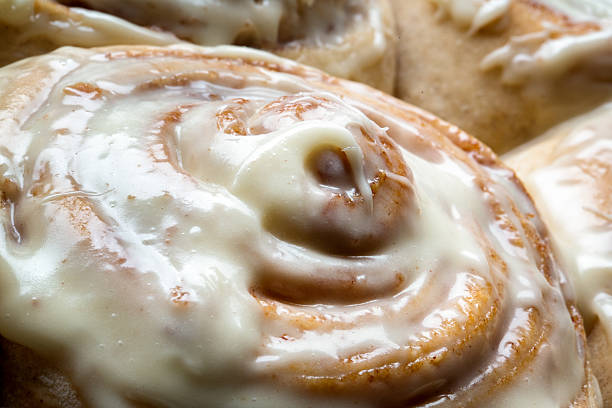 istock Fresh Baked Cinnamon rolls with creamy frosting 472498808
