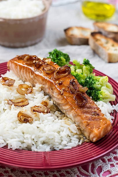 istock Maple glazed salmon with caramelized onions and rice 472500238