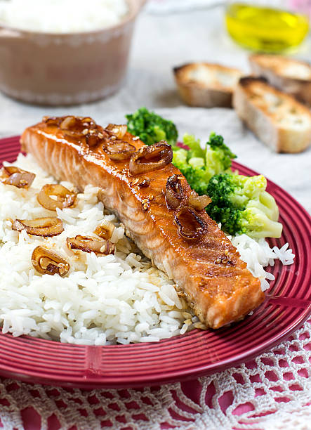 istock Maple glazed salmon with caramelized onions and rice 472500240