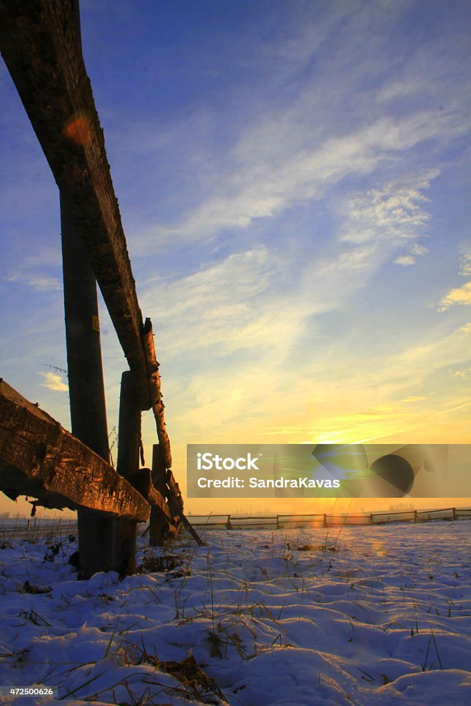 Winter sunset Beautiful winter sunset behind the fence 2015 Stock Photo