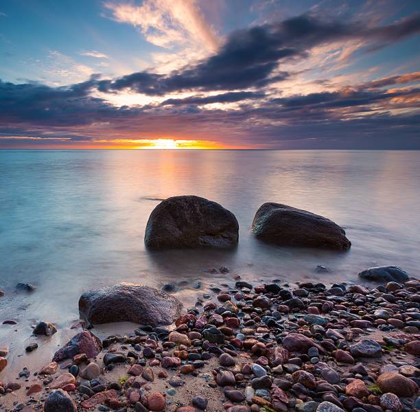 istock Beautiful rocky sea shore at sunrise or sunset. 472503184
