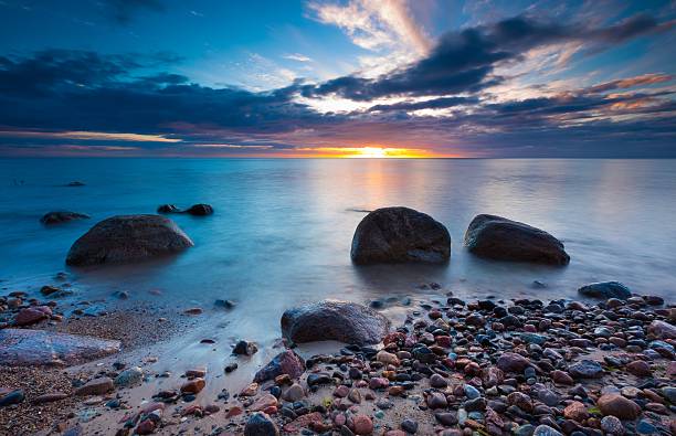 istock Beautiful rocky sea shore at sunrise or sunset. 472503196