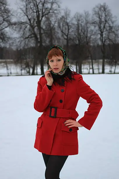 Photo of Beautiful girl in red in nature