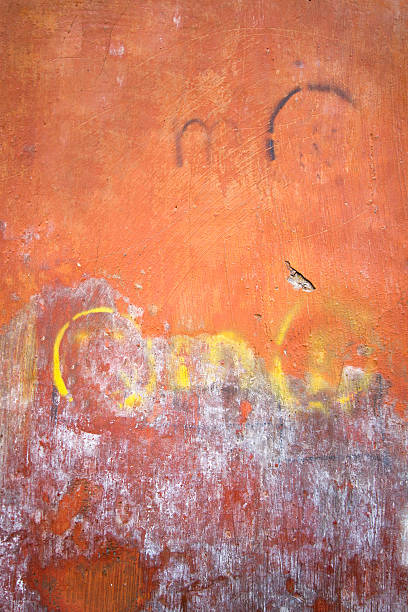 istock Vibrant Orange Mottled and Scarred Roman Wall Background Texture 472504186
