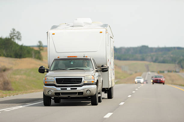istock Recreational vehicle being towed down highway 472504324