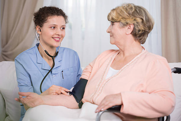 istock Young doctor during home visit 472507178