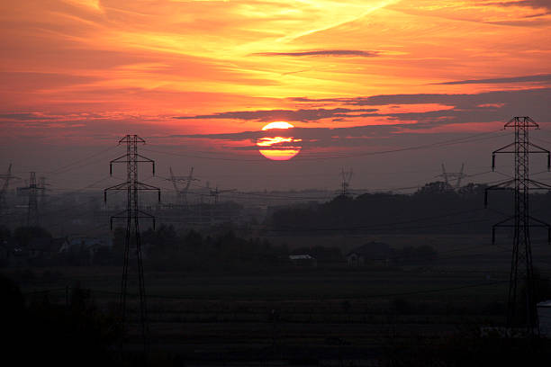 Sunset Warsaw Sunset in West of Warsaw, Poland, as seen from condominium building with view on electrical poles arma-globalphotos stock pictures, royalty-free photos & images