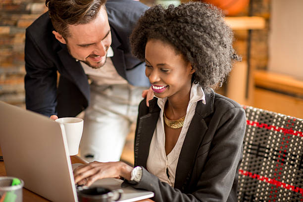 istock Man offering coffee to female colleague 472509520