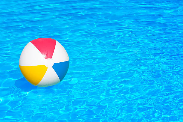 istock Inflatable ball in swimming pool 472512116