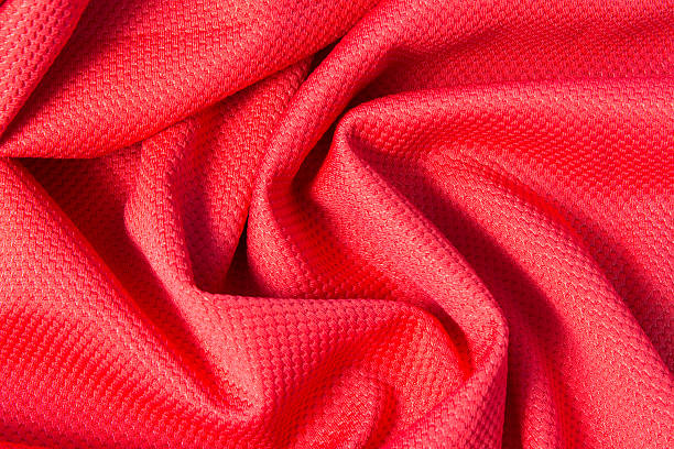 istock Texture of bright, acid rad cloth with pleats 472512144