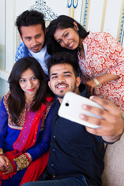 istock Group of Friends Taking a Selfie 472522768