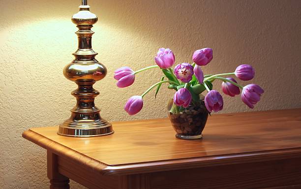 istock Sad And Wilted Tulips On A Display Table 472523022