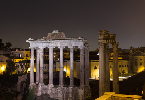 Part of the Temple of Saturn and Temple of Vespasian and Titus ruins in Rome at night