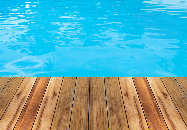 Swimming pool and wooden deck ideal for backgrounds Swimming pool and wooden deck ideal for backgrounds boat deck stock pictures, royalty-free photos & images