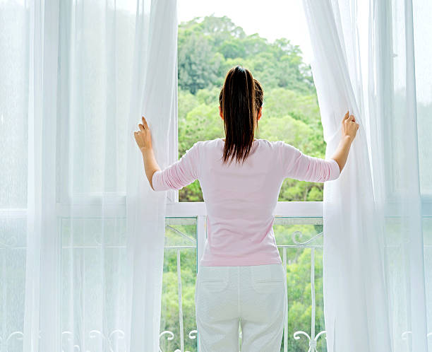 istock looks out of the window 472527344