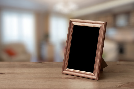 photo frames on the wooden table in the living room