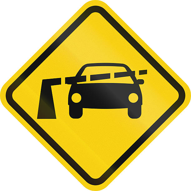 Warning road sign in Colombia: Railroad crossing with barriers ahead.