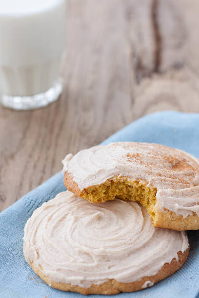 istock Pumpkin cookies with cream cheese frosting 472537688