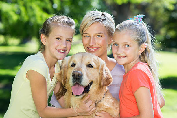 istock Happy family with their dog 472538382